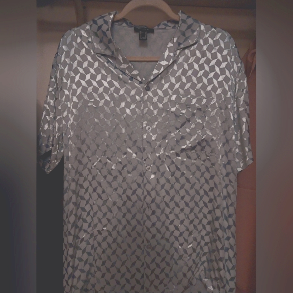 Dress Shirt. Blue, shines with light.